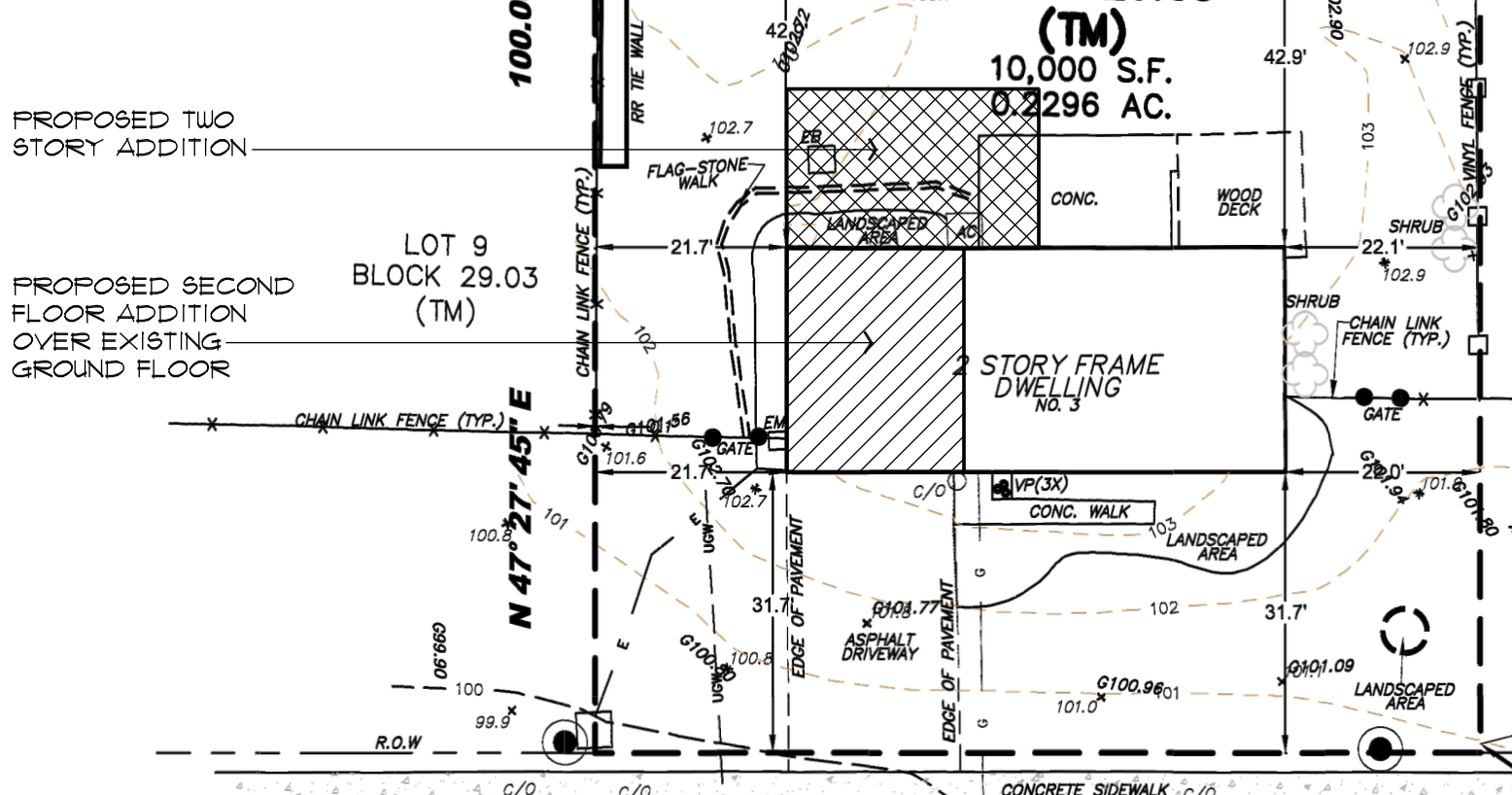 Site plan with setbacks, lot dimensions, and proposed addition footprint